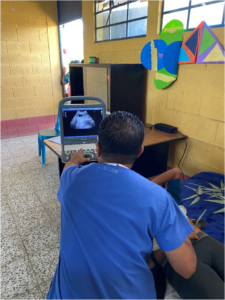 doctor performing an ultrasound on a patient
